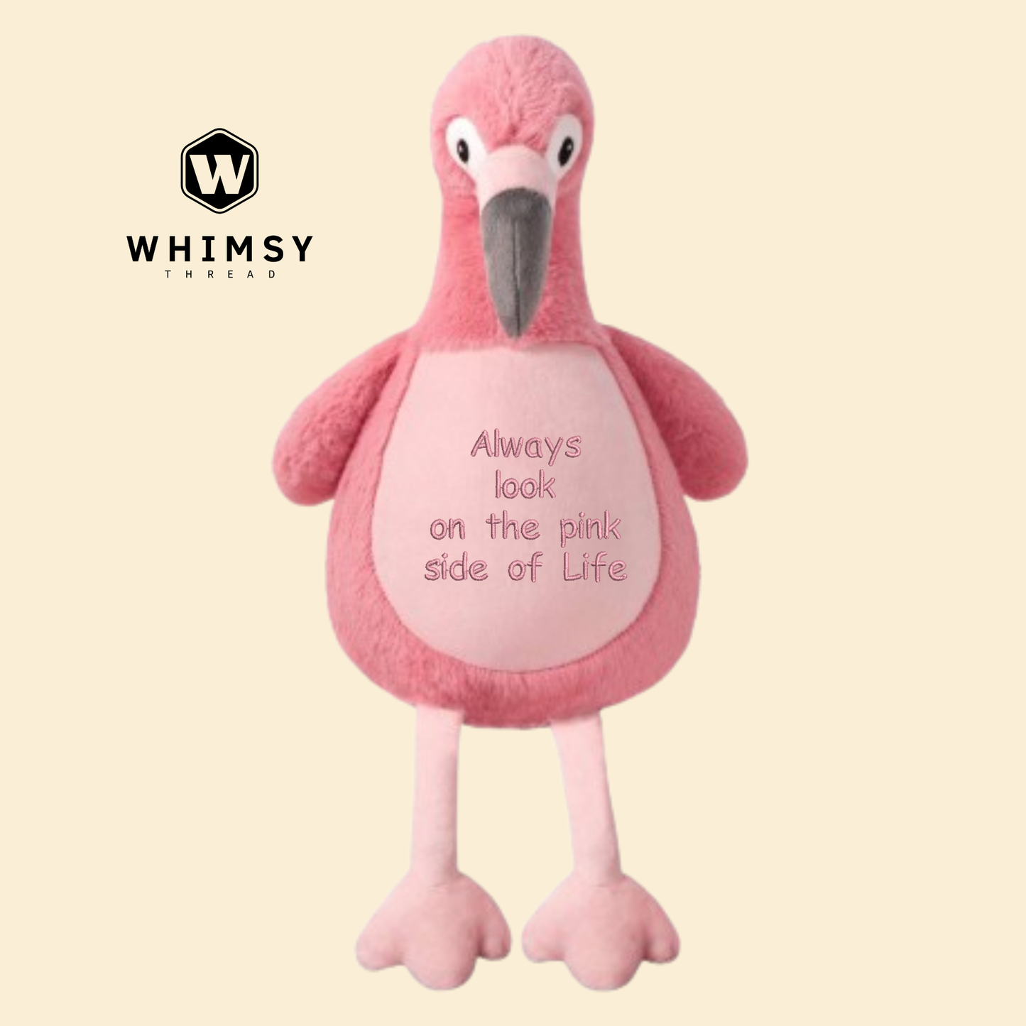Pink flamingo plush toy with text on a beige background, branded with Whimsy.